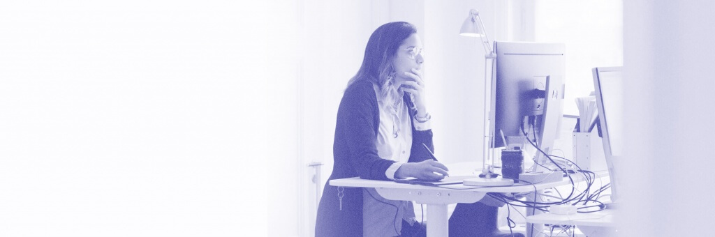 Graphic designer Juliana at her desk.