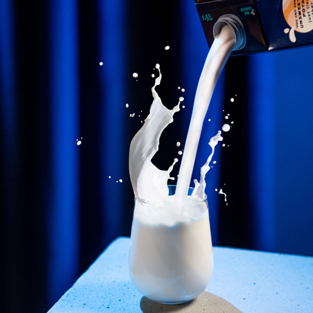 Someone pours DUG into a glass.