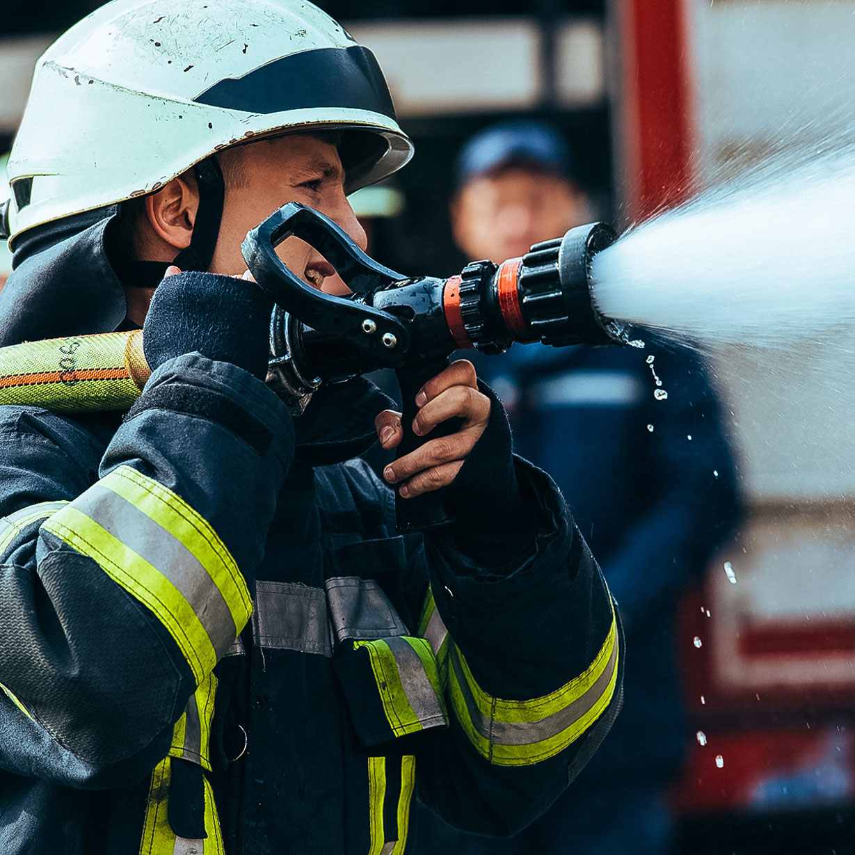 A fire-worker putting out a fire