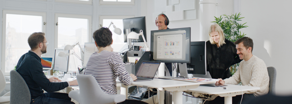 people working on their computers in a room